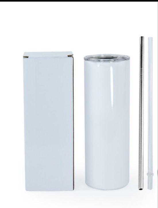 A sleek, white Kreative Kreationz Yellowstone 20oz Tumbler with a transparent lid sits beside a plain box. Next to the stainless steel tumbler are both metal and clear plastic straws, all set against a plain white background.