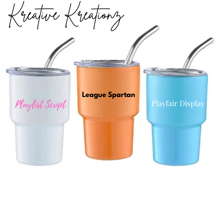 Kreative Kreationz offers three sleek Shot Glass Tumblers with metal straws. The white tumbler features "Playlist Script," the orange has "League Spartan," and the blue displays "Playfair Display." Perfect for any drink lover's collection.