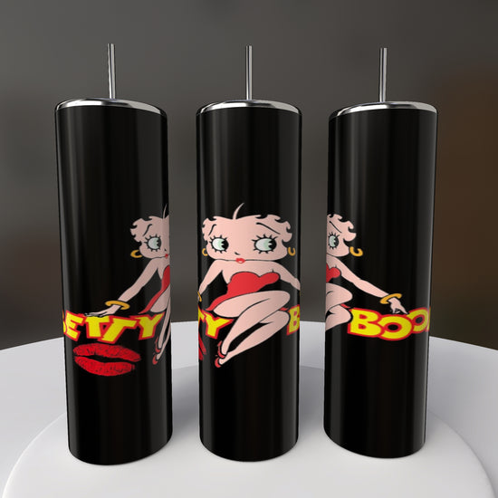 Three stylish Betty B20oz Skinny Tumblers by Kreative Kreationz feature a retro cartoon design with a woman in a red dress and bold 