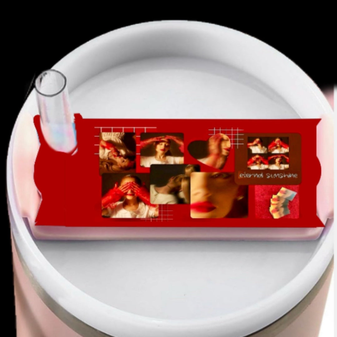 Stanley tumbler with a lid plate/topper, the topper has a red collage of external sunshine Ariana grande with wording in handwriting font of different lyrics 