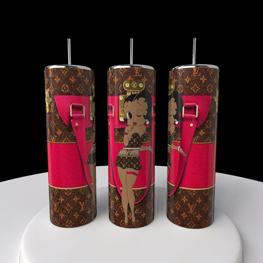 The Betty B Coach 20oz Skinny Tumbler by Kreative Kreationz has black and brown patterns with a cartoon character in swimwear. Featuring pink accents like straps and buckles, it's the perfect quirky addition to your collection.