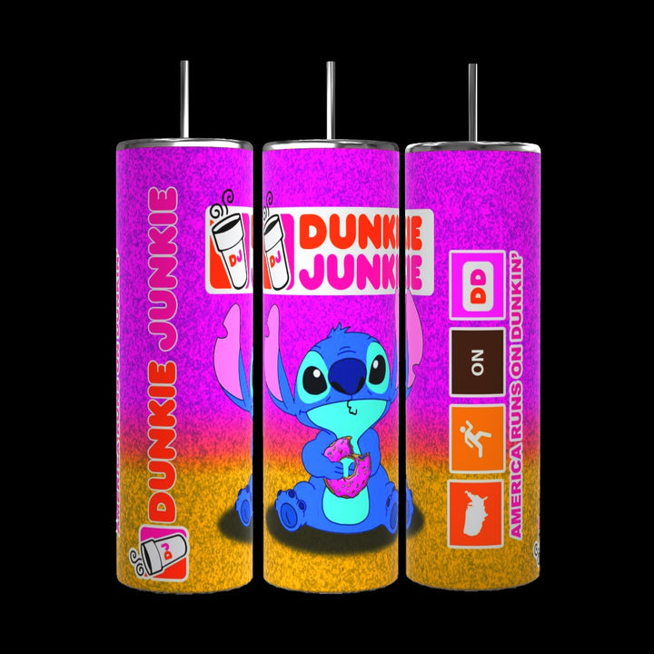 The Stitch Dunkin 20oz Tumbler by Kreative Kreationz is a set of three colorful tumblers with straws, each showcasing a blue cartoon character holding a donut. These tumblers feature the text "Dunkie Junkie," coffee cup icons, and the tagline "America Runs on Dunkin'," all set against a vibrant gradient of pink, orange, and yellow. With a durable 20 oz capacity, each tumbler is perfect for enjoying your favorite beverage.