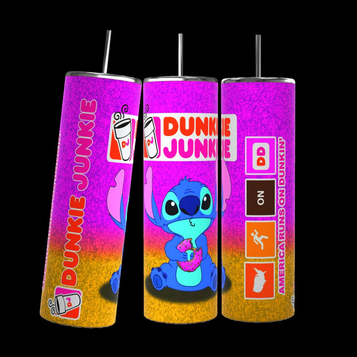 The Stitch Dunkin 20oz Tumbler by Kreative Kreationz is a set of three colorful tumblers with straws, each showcasing a blue cartoon character holding a donut. These tumblers feature the text "Dunkie Junkie," coffee cup icons, and the tagline "America Runs on Dunkin'," all set against a vibrant gradient of pink, orange, and yellow. With a durable 20 oz capacity, each tumbler is perfect for enjoying your favorite beverage.