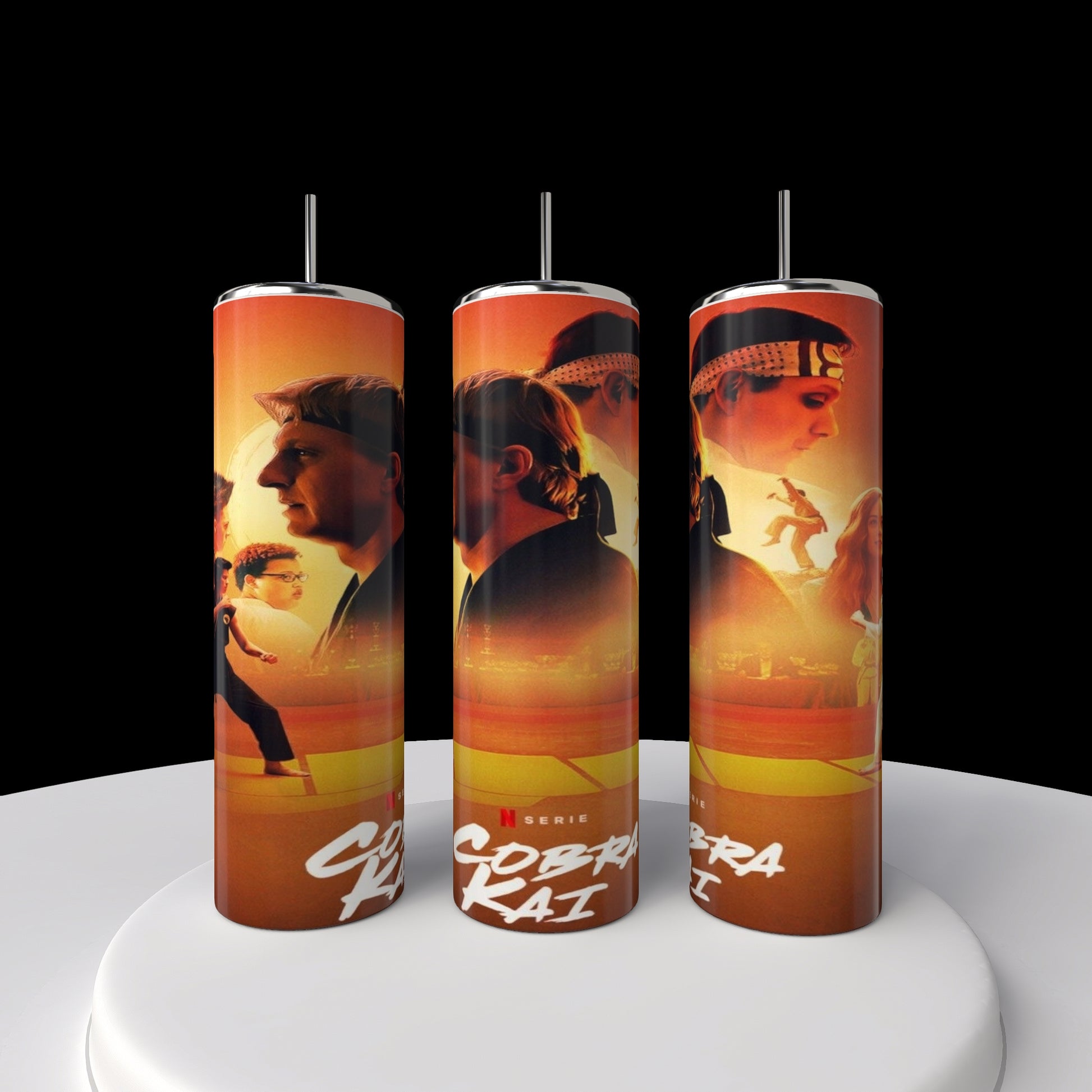 A set of three 20oz Kobra Kai stainless steel tumblers by Kreative Kreationz, each vividly sublimated with series characters in action against dynamic orange and red backdrops, prominently showcasing the "Cobra Kai" title.