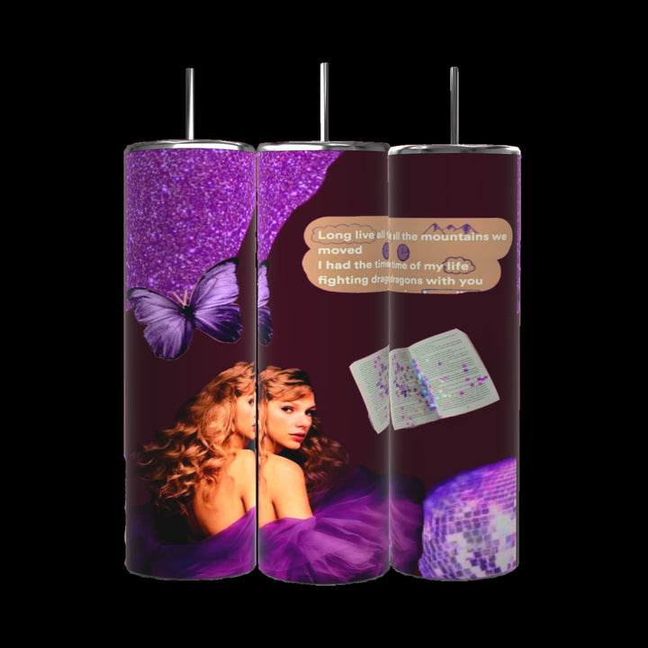 The Speak Now Taylor Swift Fanart 20oz Tumbler by Kreative Kreationz showcases a stunning rich purple theme with a butterfly motif, sequined textures, and an image of a woman wrapped in purple fabric. A text overlay reads, "Long live all the mountains we moved I had the time of my life fighting dragons with you." It also comes with a spill-proof lid.