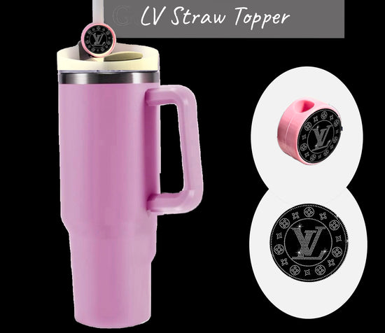 The tall pink tumbler with handle boasts the luxurious Kreative Kreationz LV Straw Topper. This black round straw topper features intricate white patterns and branded initials, enhancing the Stanley tumbler. A close-up showcases the topper next to the tumbler.