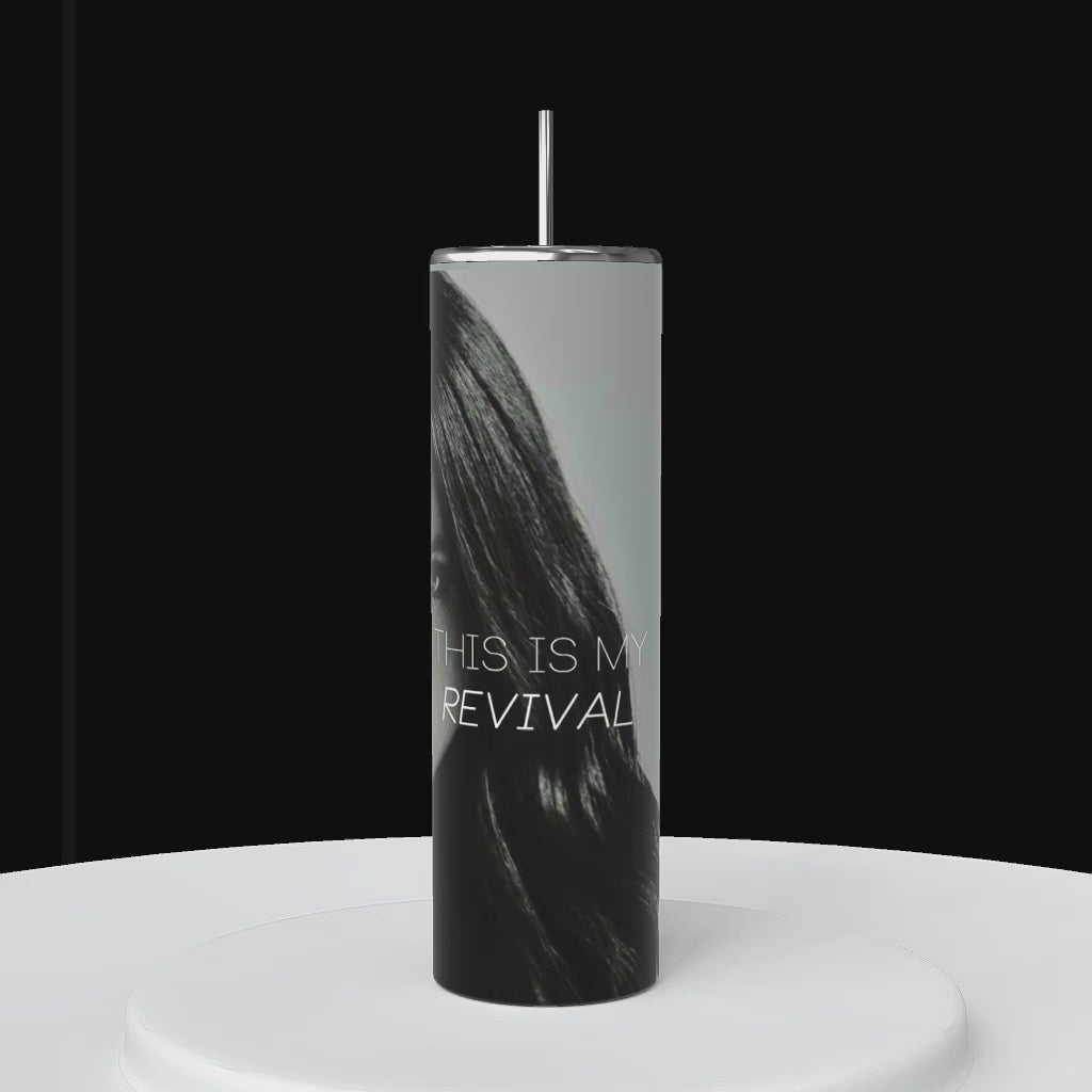 Video of 1 tall, cylindrical personalized tumbler is shown. the wrapped tumbler features the name "Selena Gomez" and a partial face image with Selena Gomez full face and the text "This is my Revival.". The background is black.